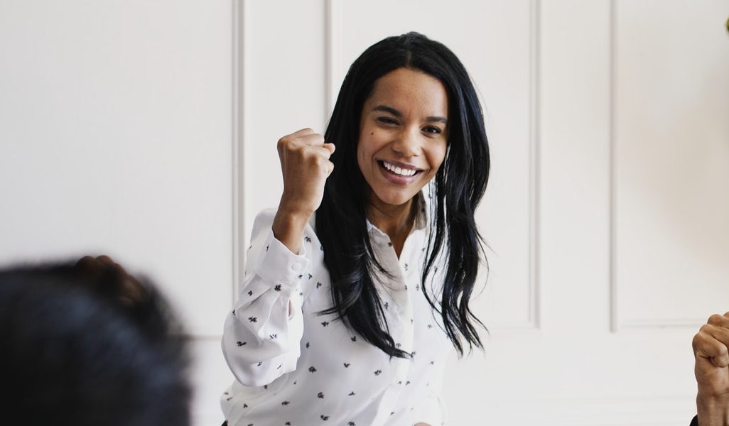 woman celebrating an achievement doing a fist bump